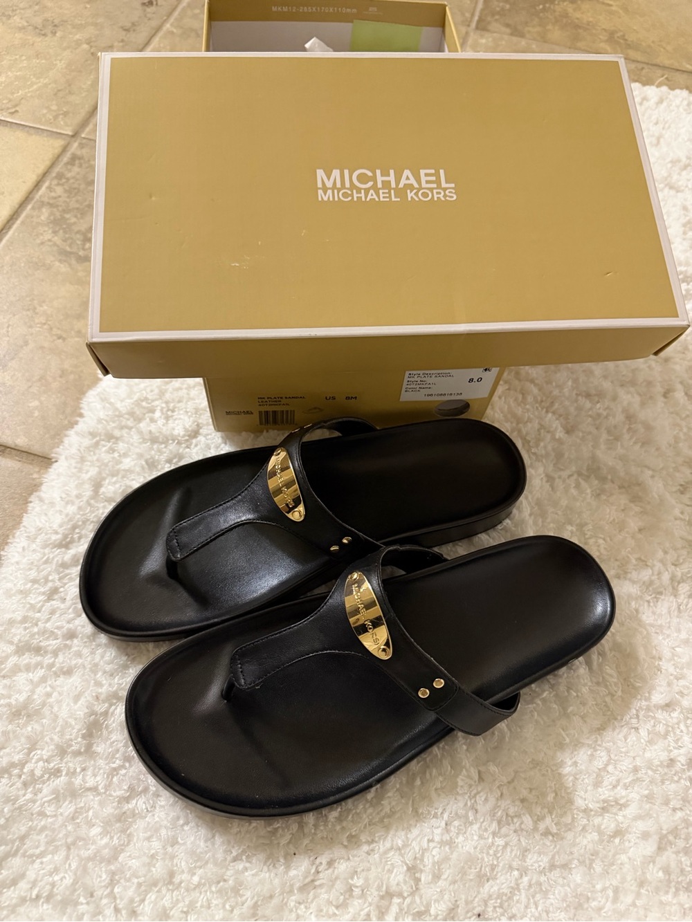 MICHAEL Michael Kors Black Leather Thong Sandals with Gold Accents